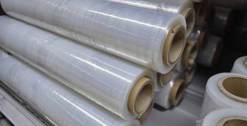 Rolled stretch palletizer tape at warehouse counter.